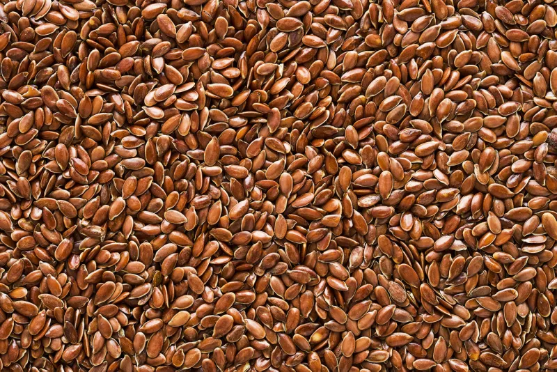 linseed or flaxseed background, brown flax seeds flat lay, copy space