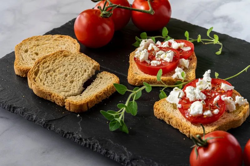 tomato, feta cheese and arugula on toast