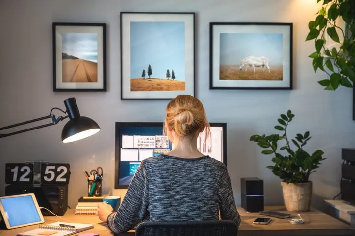 woman working on computer in her home office during pandemic quarantine