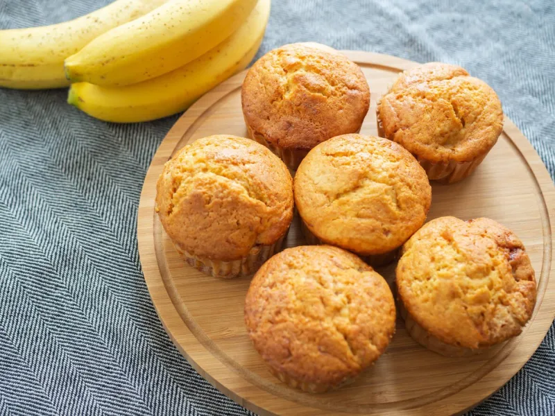 banana muffins on wooden boad