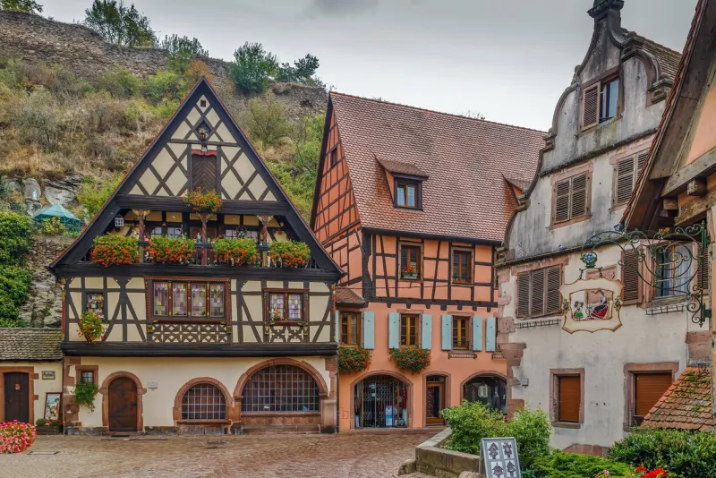 street with historical half-timbered houses in kaysersberg, alsace, france