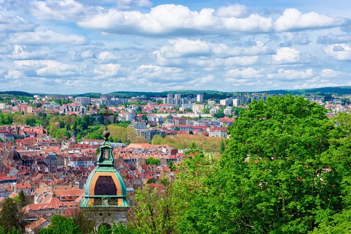 cityscape with cathedral from citadel of besancon at bourgogne franche-comte region, france town roofs and church seen from french castle and medieval stone fortress in burgundy
