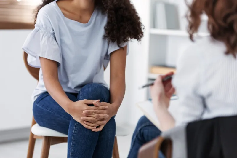 anonymous photo of two women during group psychotherapy for people with depression