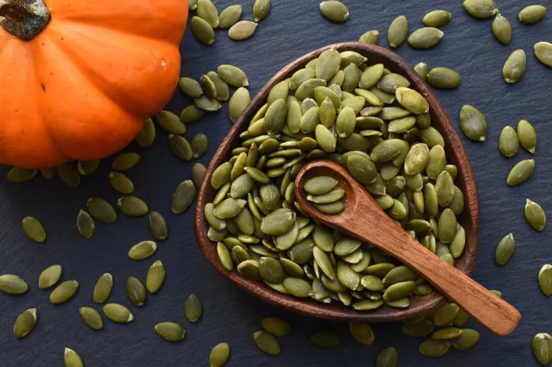 pumpkin seeds on a dark background