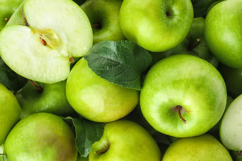 many ripe juicy green apples as background