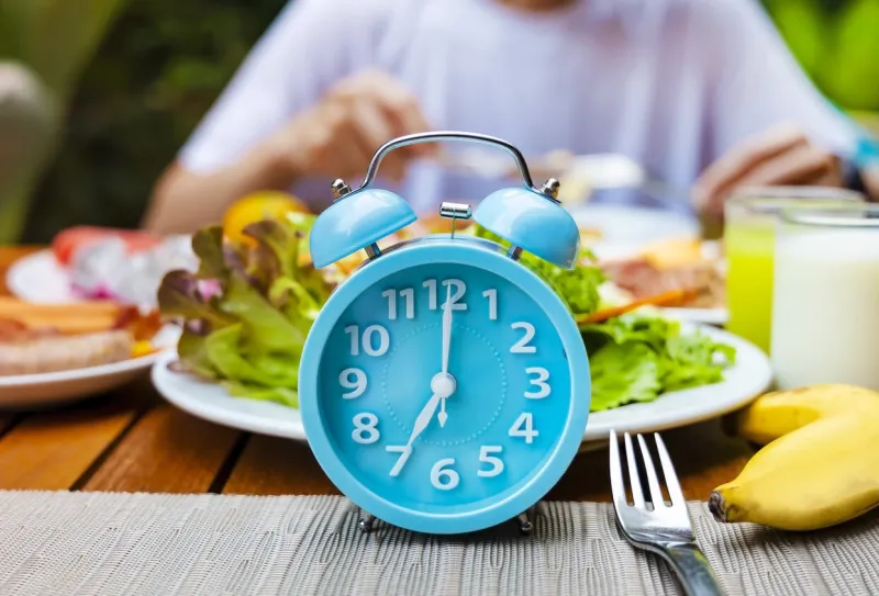 alarm clock with if (intermittent fasting) 16 and 8 diet rule and weight loss concept-diet plan concept