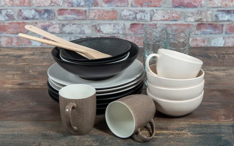 plates, bowls and cups on the table