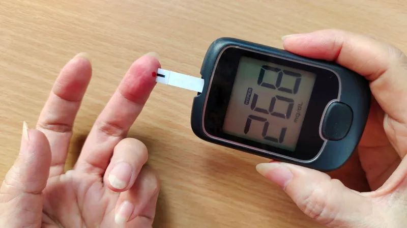 portrait showing fingertip checking high blood sugar, hyperglycemia of the patient woman, concept health care