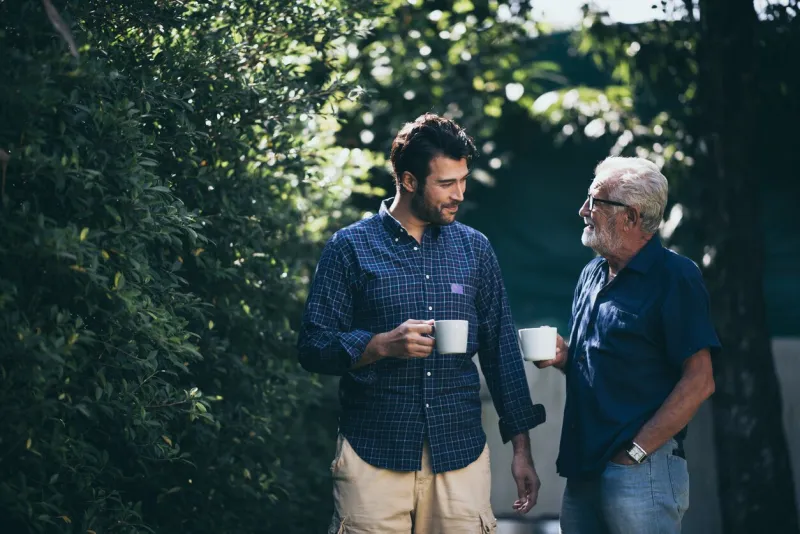 happy father and son with coffee cup