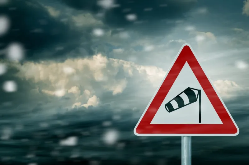 storm clouds with warning sign