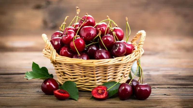 cherry on wooden basket