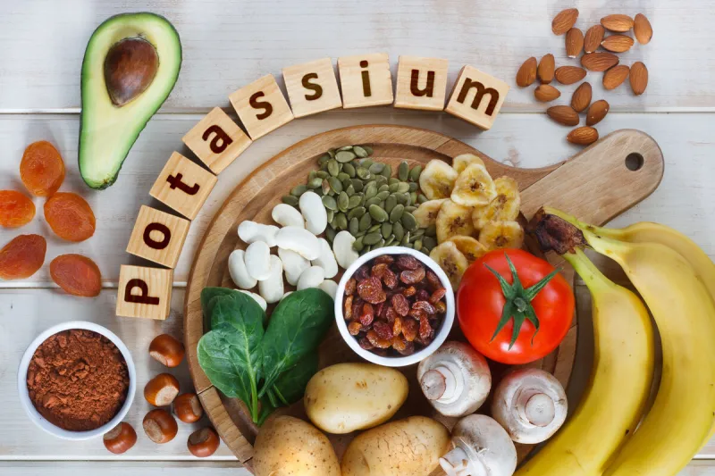 potassium food sources as dried apricots, raisins, avocado, cocoa, bean, pumpkin seeds, dried banana, potatoes, tomatoes, spinach, mushrooms, fresh banana, hazelnuts, almonds