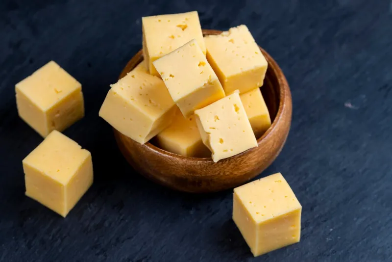 diced hard orange cheese, fresh orange cheese cut into cubes