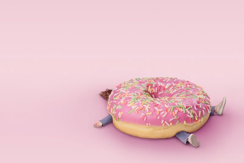 girl with donut fast food concept, overweight minimal pink background with copy space