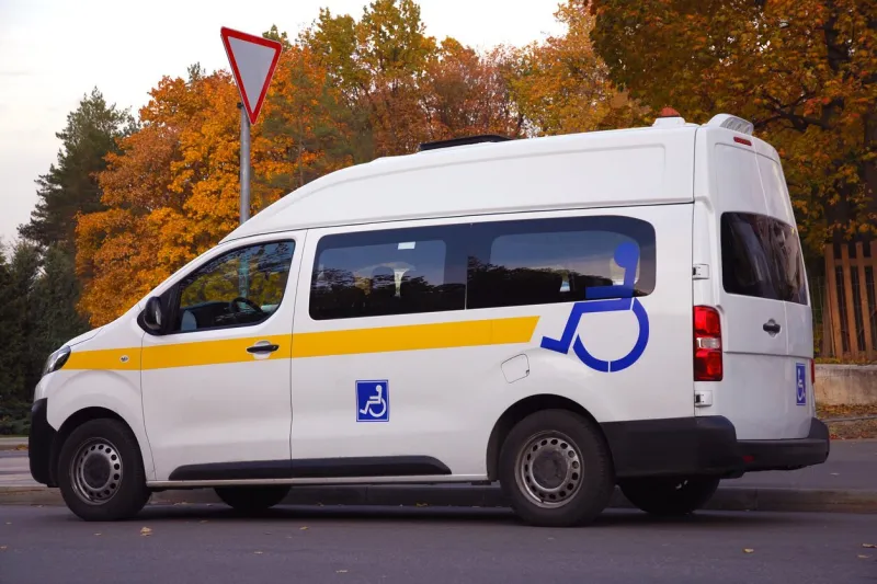 minibus for disabled passengers with disability icons or signs on it