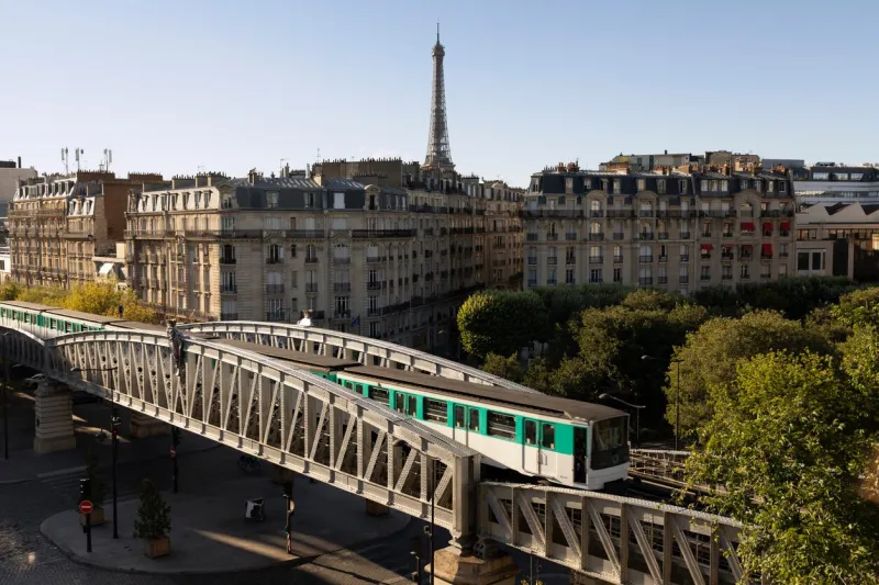 paris metro train with view of eiffel tower