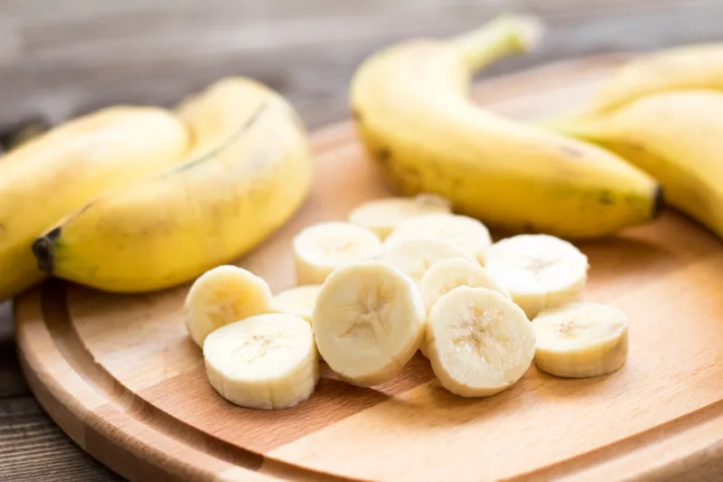 fresh bananas on wooden background