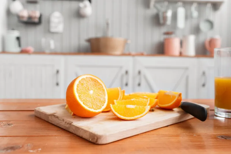 sliced oranges on a wooden cutting board healthy and tasty breakfast