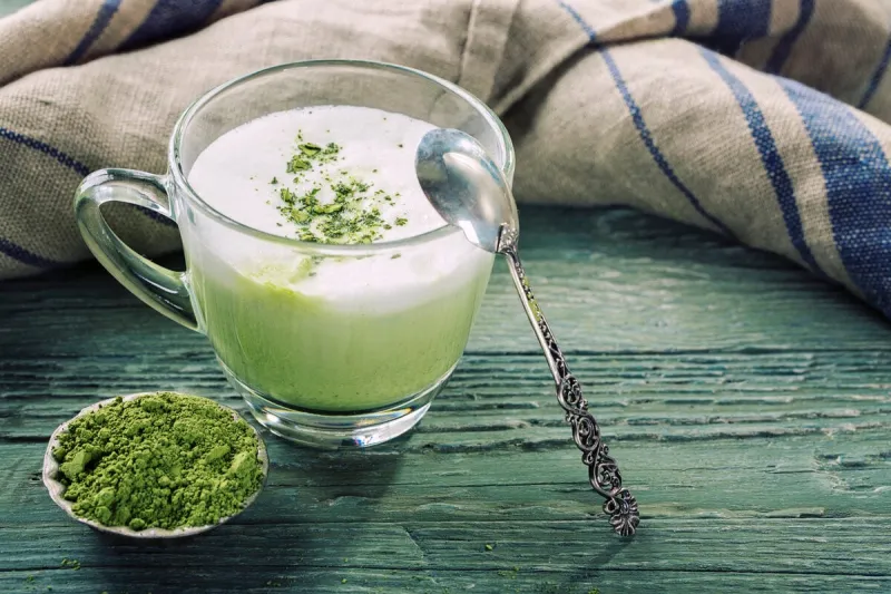 matcha green tea latte on a wooden background