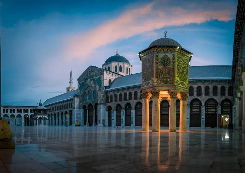 day panoramic view of the umayyad mosque during a sunset showing the islamic architecture and islamic art in this holy place in damascus syria