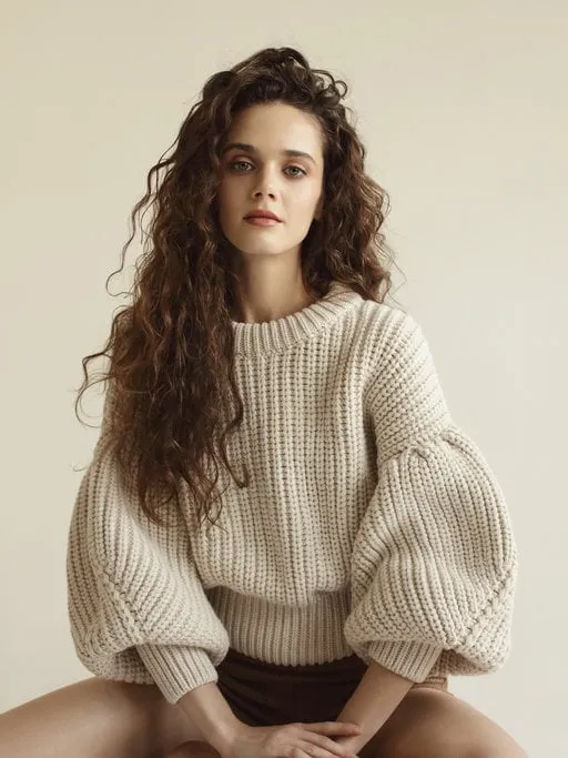 portrait of young beautiful woman wearing beige sweater