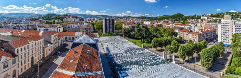 panoramic view of saint etienne cityscape as seen from the tower of cite du design in downtown direction buildings of higher school of art and design are at foreground the montaud hill is at right