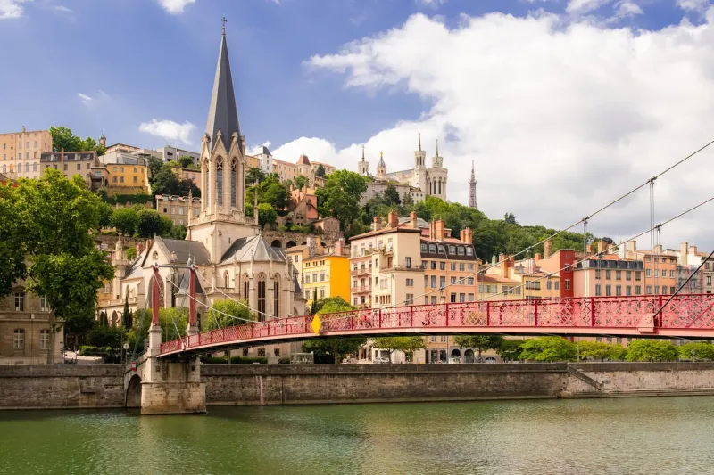 vieux-lyon, saint-georges church, colorful houses and footbridge in the center, on the river saone