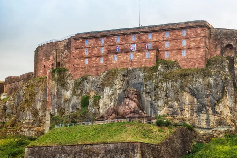 the citadel of belfort with the lion of bartholdi below