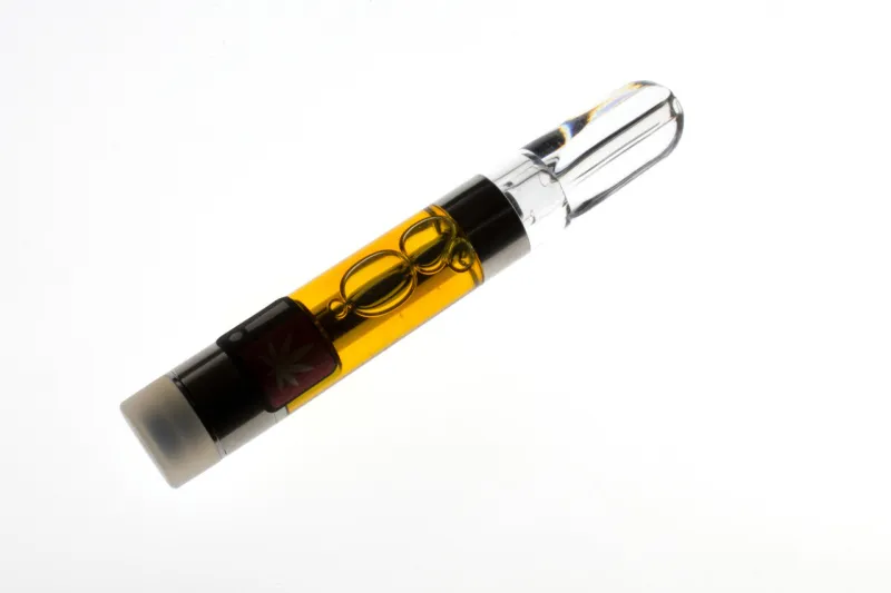backlit marijuana vape pen cartridge, with amber-colored resin e