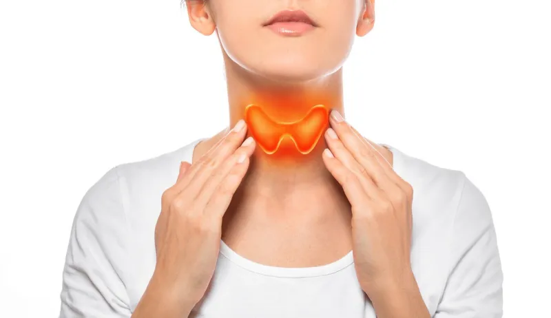 woman showing painted thyroid gland on her neck enlarged butterfly-shaped thyroid gland, isolated on white background