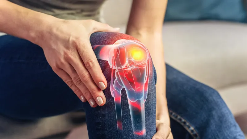 vfx joint and knee pain augmented reality render close up of a person experiencing discomfort in a result of leg trauma or arthritis massaging the muscles to ease the injury