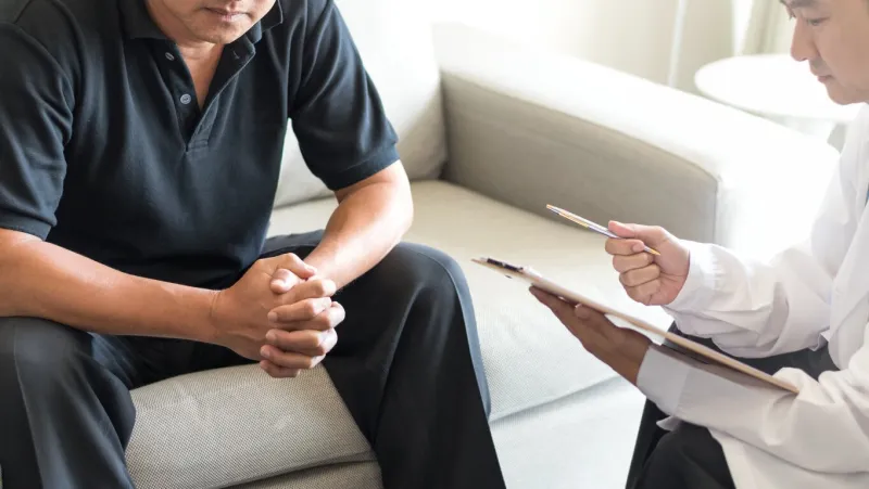 urologist doctor giving consult for prostate problems to patient urologic oncologists specialize in treating cancer of the urinary tract and male reproductive organs mens health problem concept