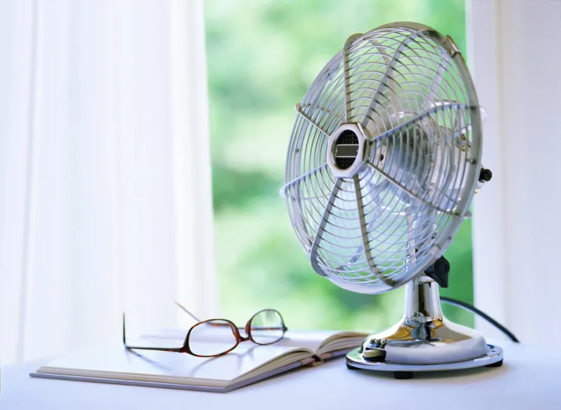 electric fan and book