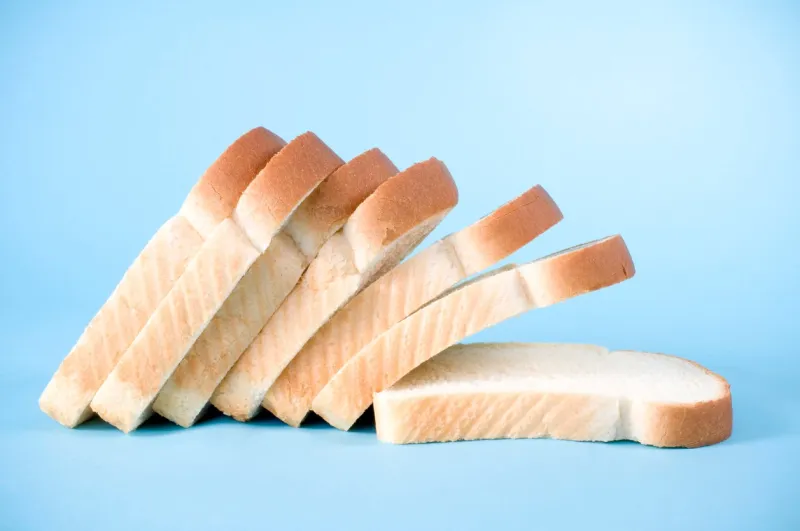 slices of white bread on a blue background