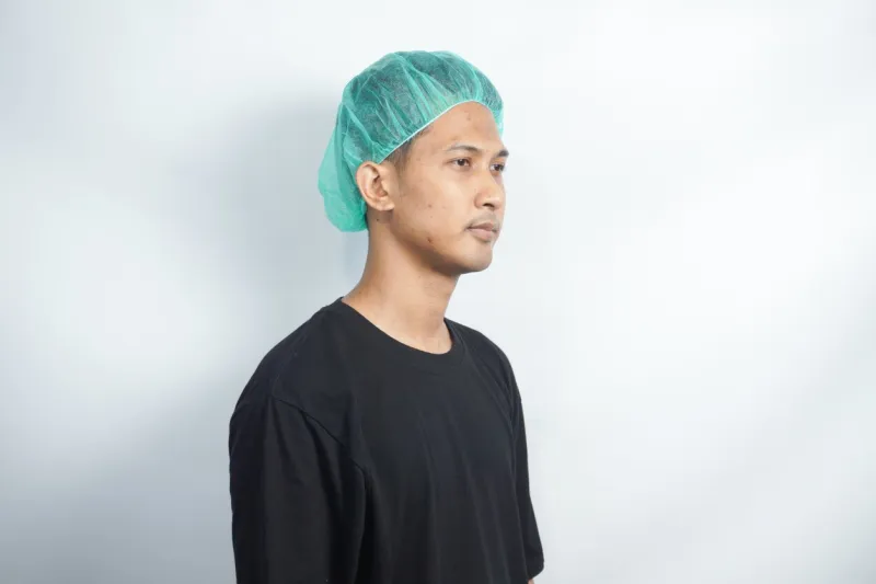 asian youth wearing hairnet isolated on white