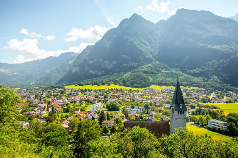 landscape view on balzers village with saint nicholas church in liechtenstein