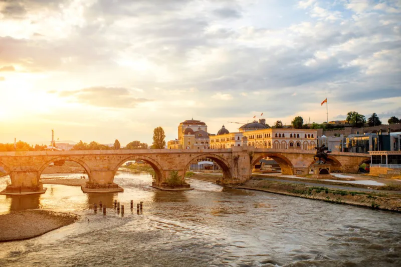 view on stone bridge from oko bridge in skopje on sunset