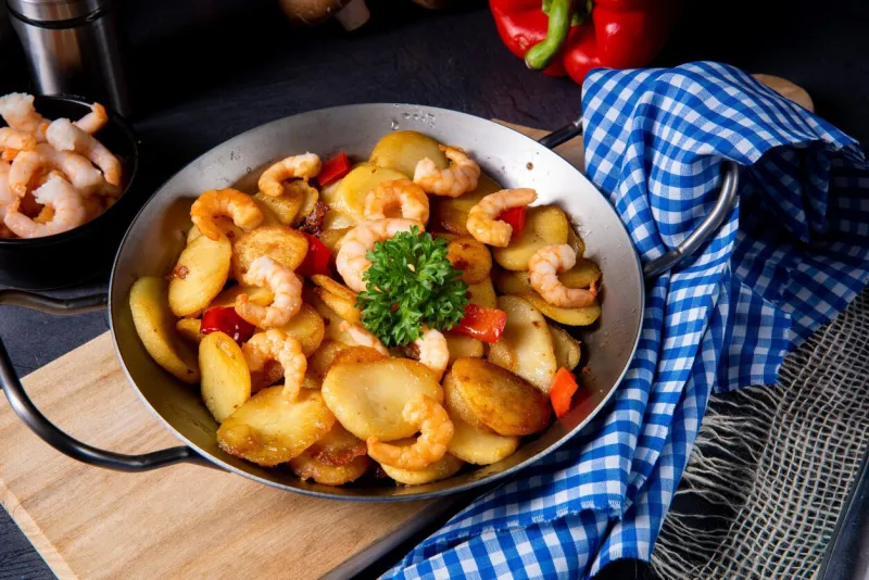 a delicious fried potato and shrimp pan