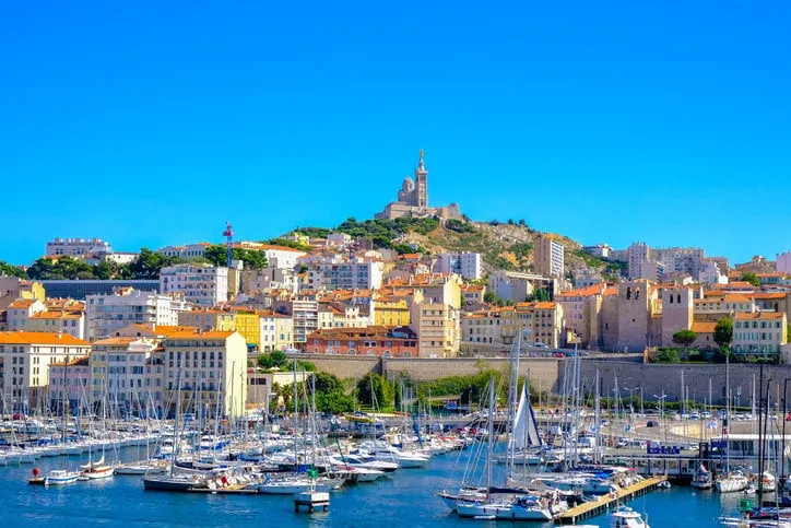 marseille embankment with yachts and boats in the old port and notre dame de la garde, vieux-port de marseille