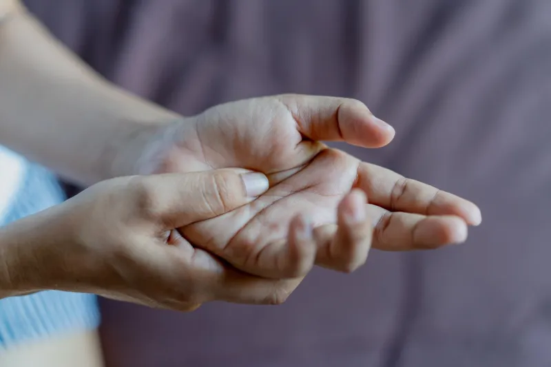 woman has pain in her wrist hand with wrist pain