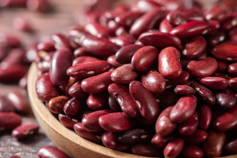 close up of raw red kidney beans on table