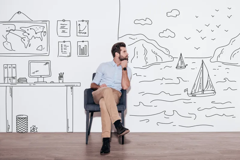 young handsome man keeping hand on chin and looking away while sitting in the chair against illustration of fjord vs working place