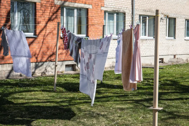 hangig clothes to dry on a linen cord courtyard of an apartment house