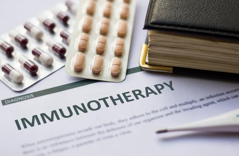 immunotherapy - diagnosis printed on white paper with medication, injection, syringe and pills