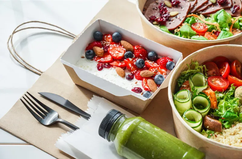 healthy meal slimming diet plan daily ready menu background, organic fresh dishes and smoothie, fork knife on paper eco bag as food delivery courier service at home in office concept, close up view
