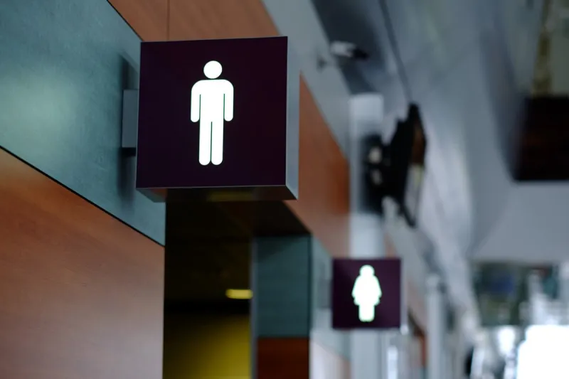 entrance to the male and female toilet sign in airport