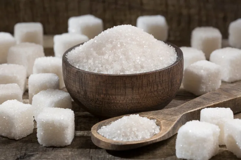 white refined sugar powder and cubes