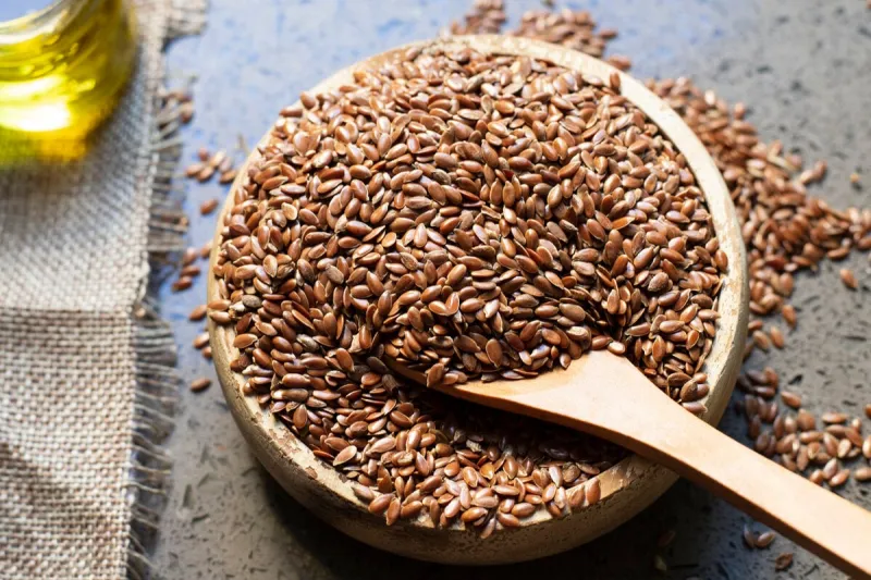 flax seeds in a wooden bowl