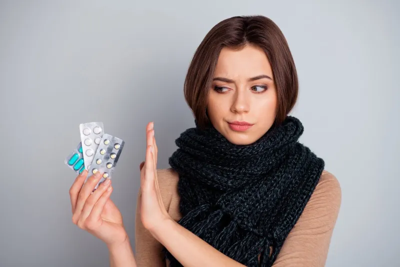 portrait of minded pensive lady hold hand unaware need medical, inflammation allergy antibiotics wear beige clothes youth isolated grey background