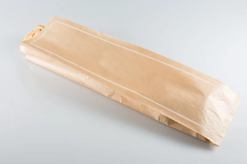 bread brown paper bag isolated on white background